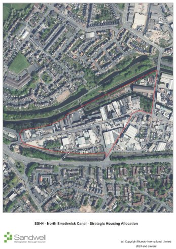 Outline of a proposed development area along the North Smithwick Canal, showing red boundary lines across a mixed urban landscape with residential, commercial, and industrial buildings, and green spaces.